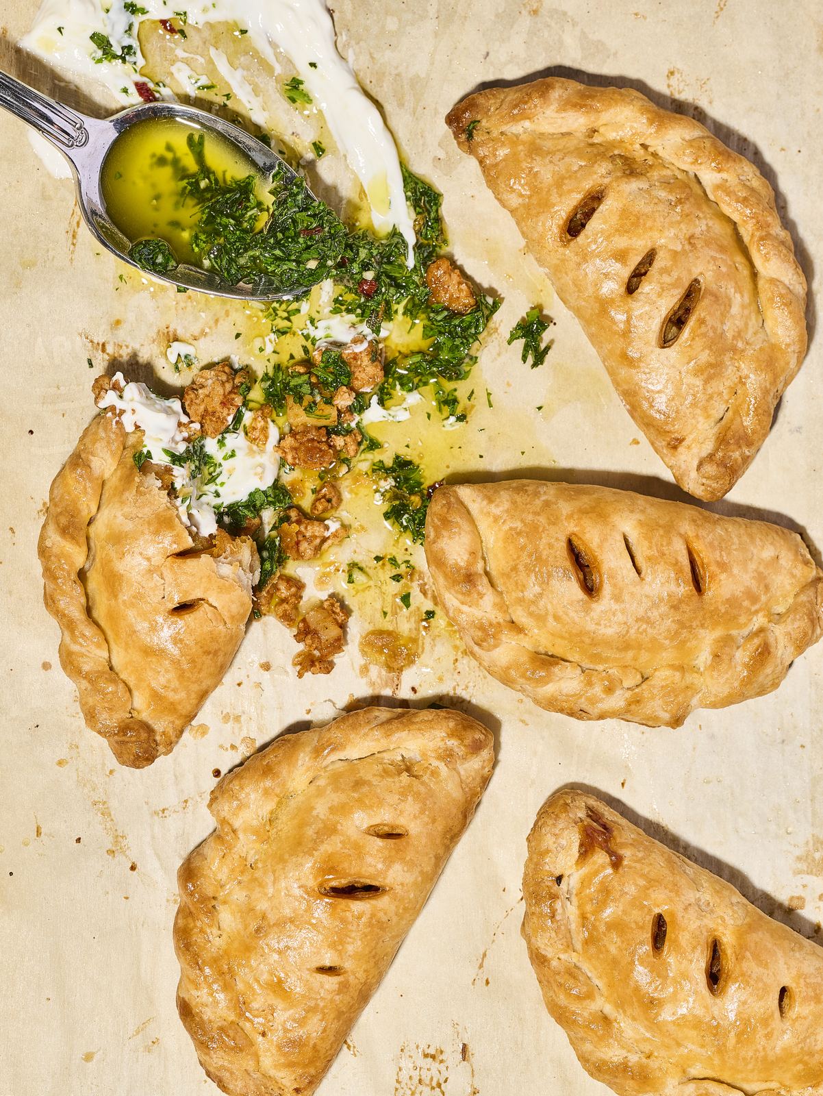 Golden baked empanadas with chimichurri